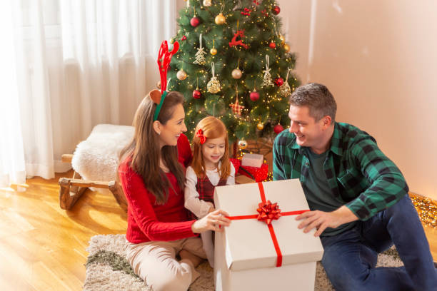 istock Family opening Christmas presents 1285126897