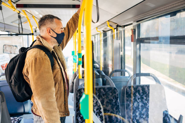 istock Responsible commuter follow every safety rules during COVID-19 pandemic while travelling with public transportation 1285128612