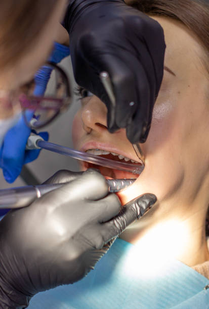 istock A woman at a dentist's appointment to replace arches with braces 1285130025