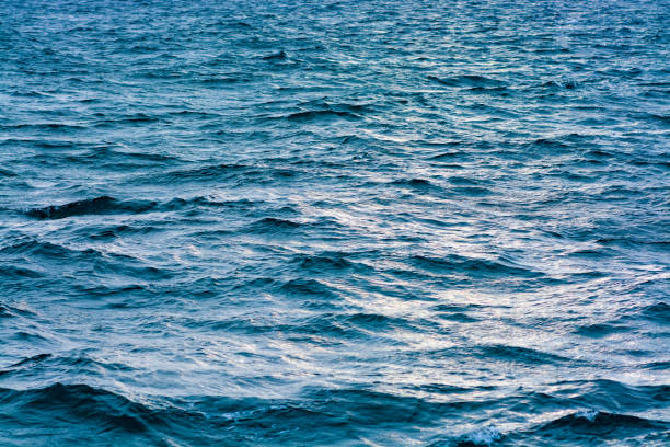 istock Blue sea water in daylight. 1285131409