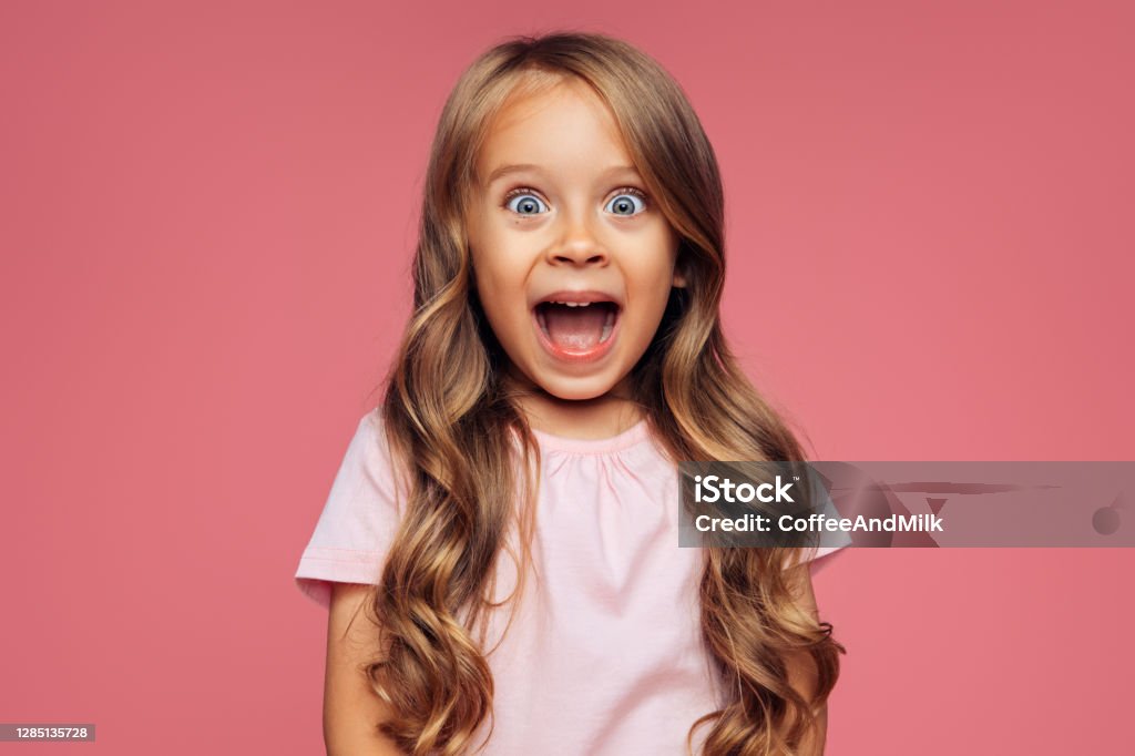 Funny girl on pink background Child Stock Photo