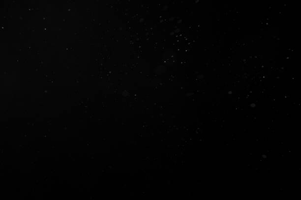istock Dust, snow or water spray particles isolated on black 1285135745