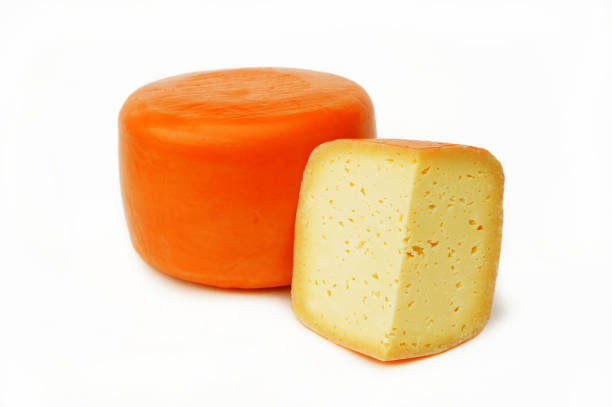 istock Round head of hard cheese with a small slice 1285137535