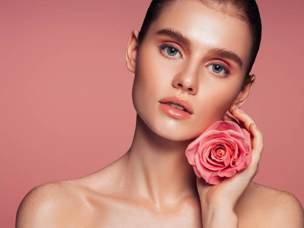 istock Beautiful woman with rose 1285139126