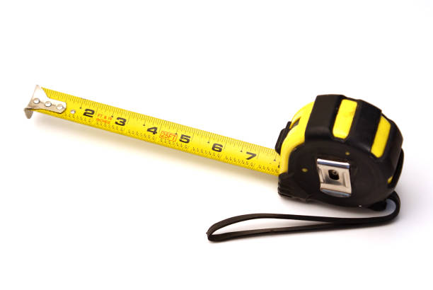 nastro di misurazione - tape measure yellow long instrument of measurement foto e immagini stock