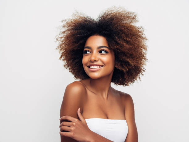 istock _Beautiful smiling girl with curly hairstyle 1285140010