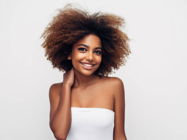 istock _Beautiful smiling girl with curly hairstyle 1285140131