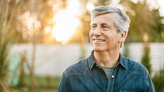 Senior man portrait at sunset