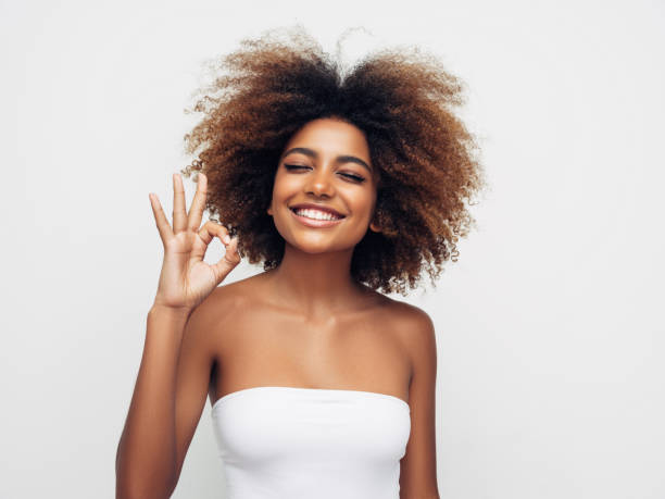 istock _Beautiful smiling girl with curly hairstyle 1285140309