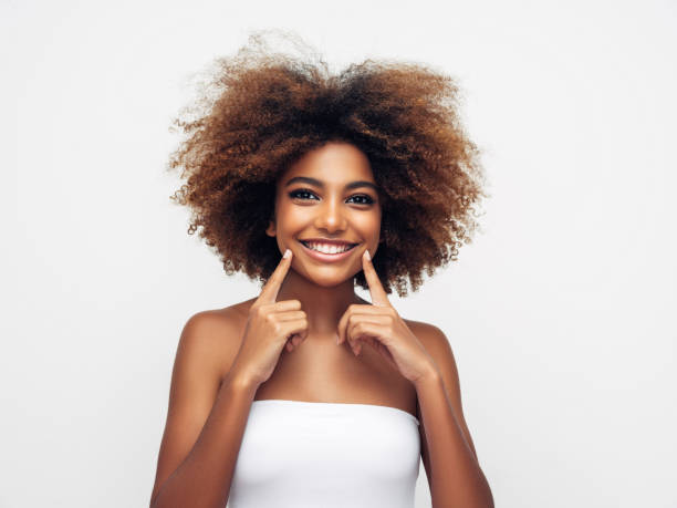 istock _Beautiful smiling girl with curly hairstyle 1285140979