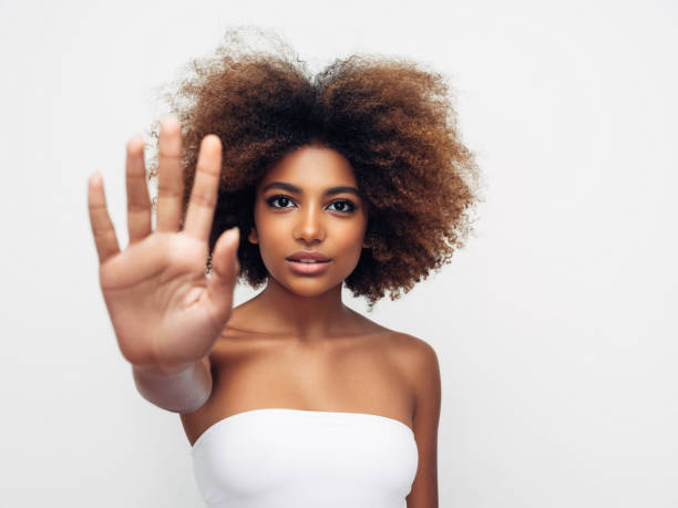 istock Beautiful young girl saying to stop 1285141061