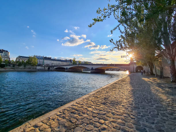 istock Pedestrian walkway alongside the Seine River in Paris. 1285141261