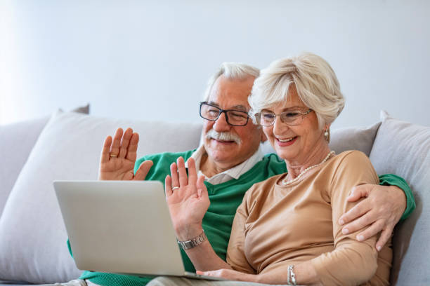 istock Happy senior couple having video call on laptop. 1285142868