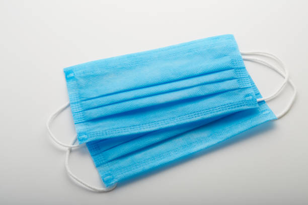 istock Group of surgical protective face masks on white background 1285143750