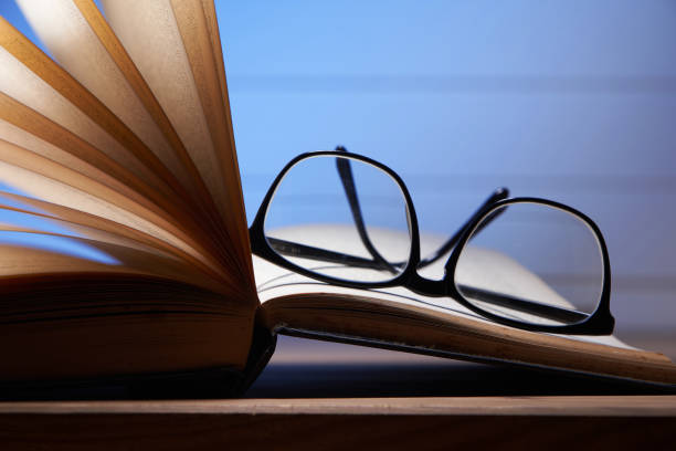 istock Eye glasses are laying on a book . selective focus 1285145454