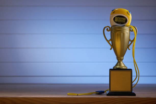 istock trophy with stopwatch on the blue background 1285145870