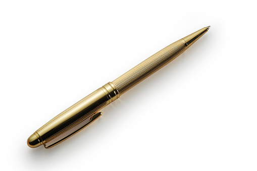 Studio shot of a gold color ballpoint pen isolated on white with drop shadow