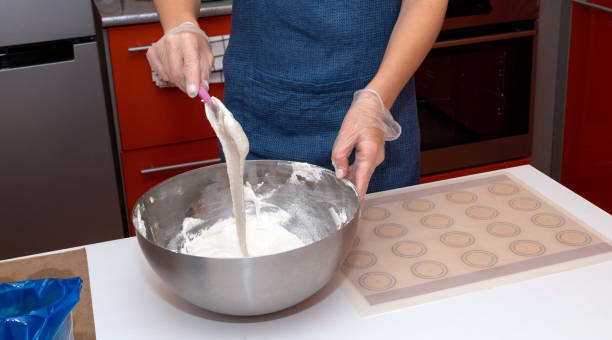 istock In a metal up, mix the batter with a spatula. Cooking process. 1285146999