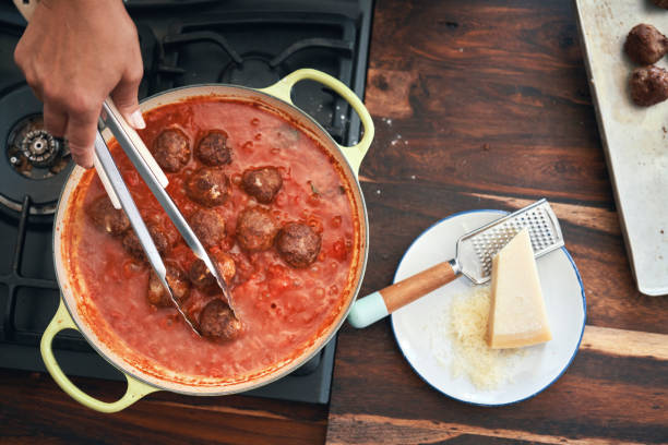istock Preparing Meatballs with Tomato Sauce in a Pan 1285147080