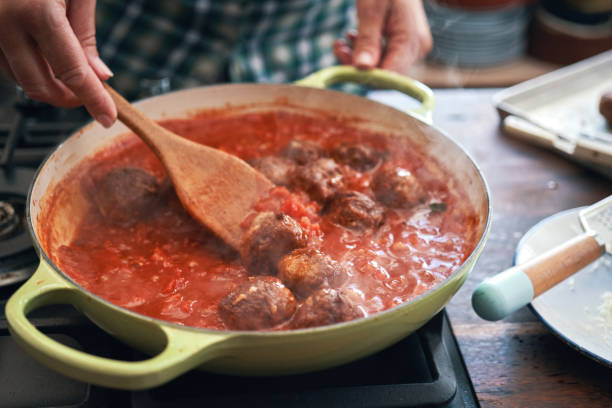 istock Preparing Meatballs with Tomato Sauce in a Pan 1285147099