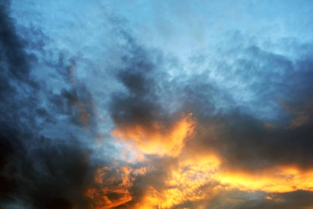 istock dark stormy dramatic sky at sunset. Backgroud 1285147219