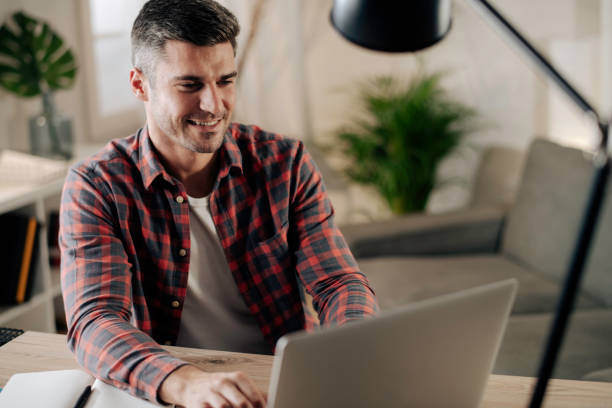 istock Young man working at home stock photo 1285147308