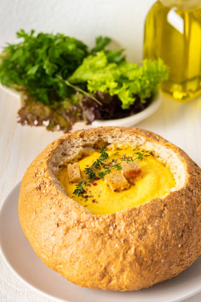 istock Pumpkin puree soup in a plate of bread 1285150593