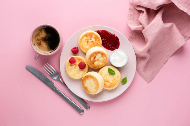 istock Syrniki, curd or cottage cheese pancakes with raspberry jam 1285150719