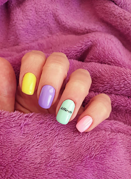 istock female hand beautiful colored manicure sweater 1285152372