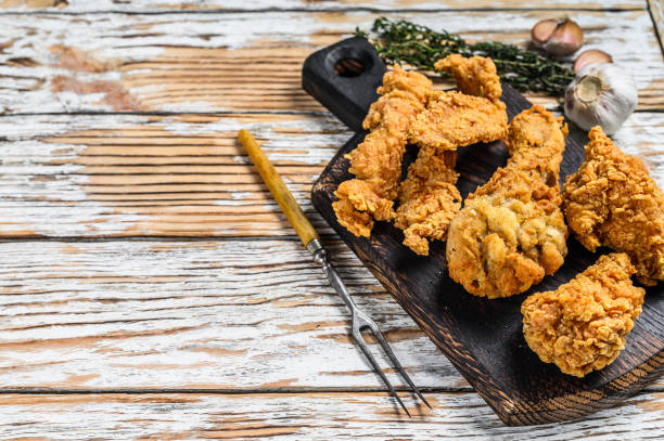 istock Crispy chicken drumstick, leg, wing and breast strips. White Wooden background. Top view. Copy space 1285157458