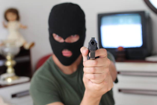 istock Spooky intruder holding a gun 1285158271