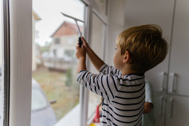 istock Little boy helping with house chores 1285159498