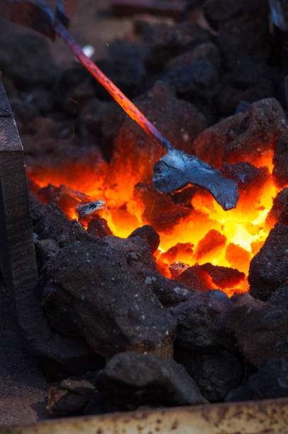 istock blacksmith furnace with burning coals, tools, and glowing hot metal workpieces 1285160259