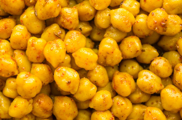 istock Cooking chickpeas with spices in a pan, close-up 1285160498