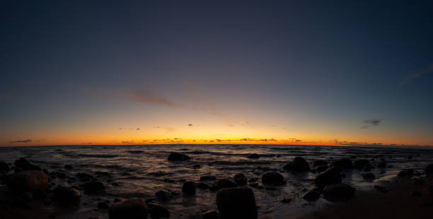 istock Sunset, panoramic view of the sandy beach 1285160587