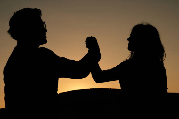 istock Couple backlit at sunrise 1285160919