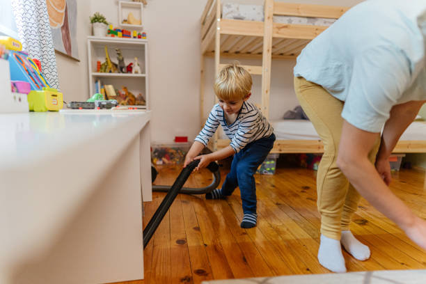 istock Helping my mom with house chores 1285160956