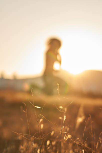 istock Defocused woman in the field jumping 1285161873