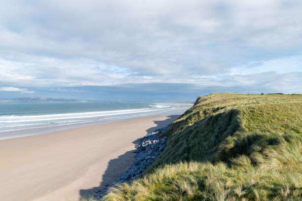 view across the dunes and the beach of Barrow, Tralee,Ireland Barrow beach on a fine day in Tralee golf club, Ireland town of hope stock pictures, royalty-free photos & images