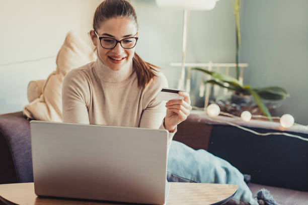 istock Young woman shopping from home 1285164199