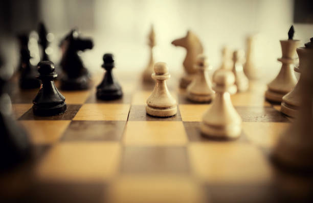 istock Wooden chess pieces on the chessboard. Intellectual game -chess. 1285164283