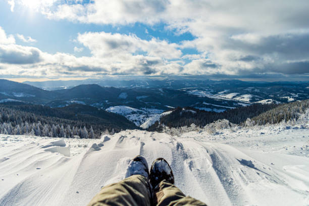 istock Traveler sitting on mountain peak 1285166242