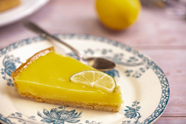 istock Slice of lemon pie on an old plate 1285166516