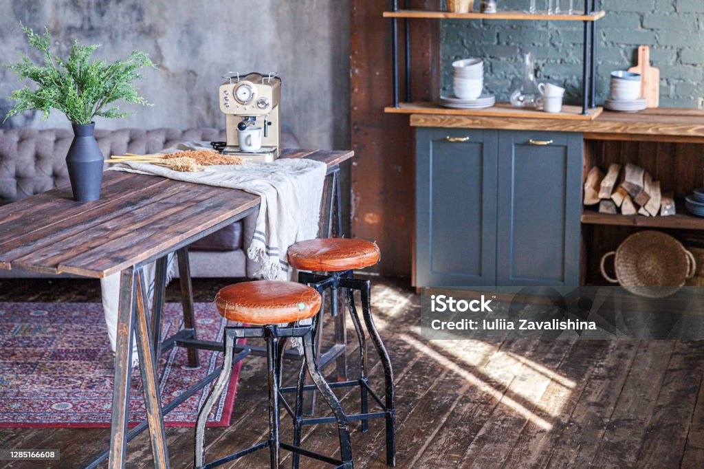 Scandinavian classic minimalistic dark gray kitchen with wooden details. Stylish loft modern gray kitchen decoration with clean contemporary style interior design Apartment Stock Photo