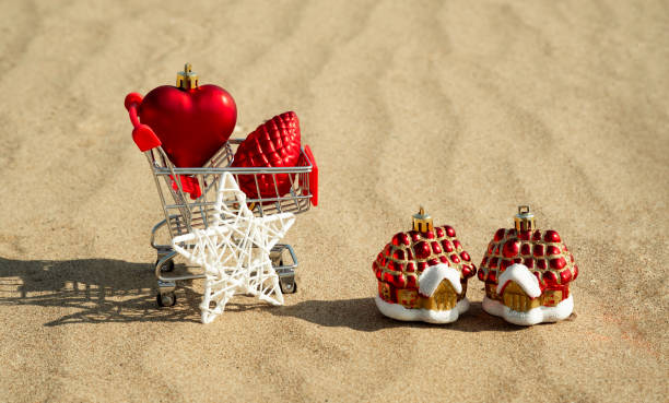 istock Mini-cart with Christmas decorations on the beach 1285170662