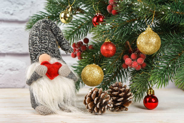 istock New Year toy  with red heart on Christmas tree background 1285176240
