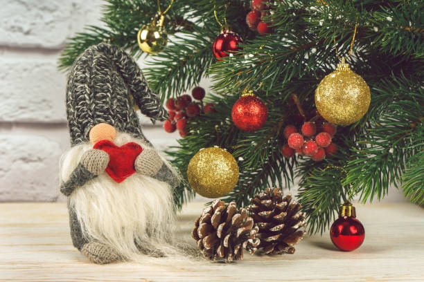 istock New Year toy  with red heart on Christmas tree background 1285176268
