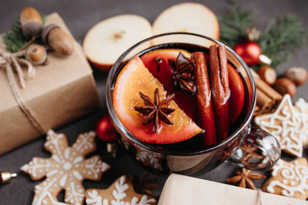 istock Holiday background with mulled wine and gift boxes 1285178390