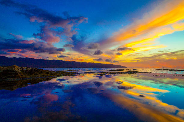 istock Beautiful sunset reflection on the North Shore of Oahu 1285179043
