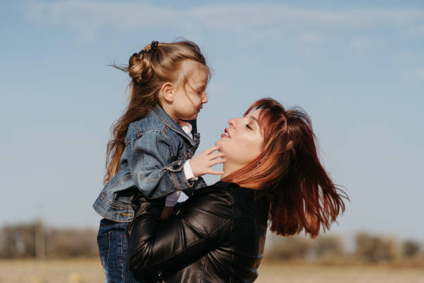 istock Mother walking outdoors with her little daughter 1285179306